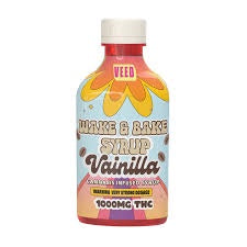 Bottle of vanilla extract with colorful label on a white background