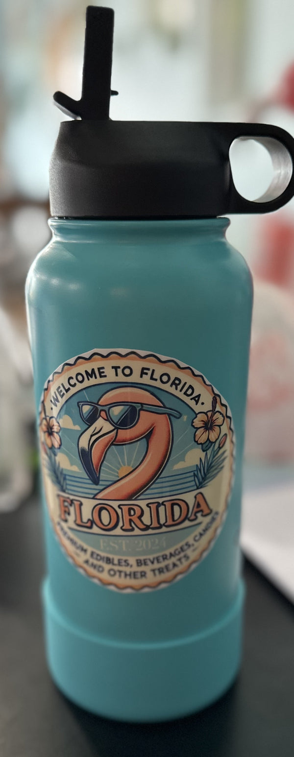 Blue water bottle with Florida-themed design on a blurred background